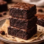 Deliciously rich fudgy brownies with a gooey center and chocolate glaze.