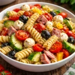 Delicious and colorful Italian pasta salad with fresh vegetables and herbs