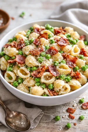Creamy pasta salad with vegetables and dressing in a bowl