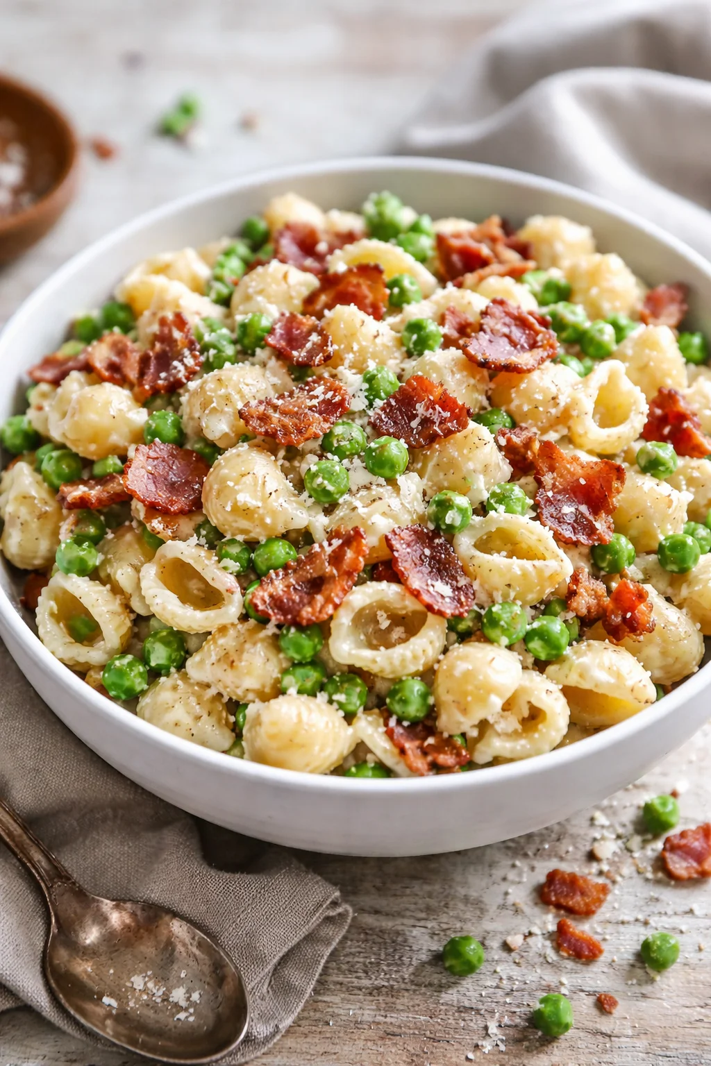 Creamy pasta salad with vegetables and dressing in a bowl