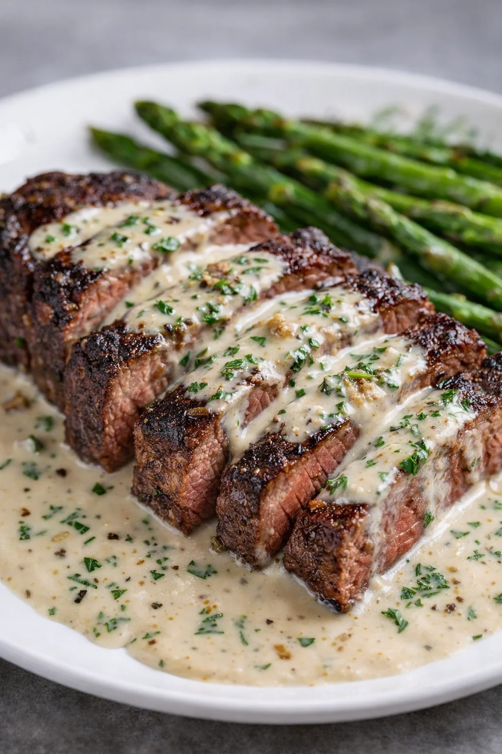 Delicious Garlic Butter Steak served with creamy Parmesan sauce