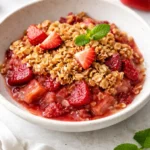 Delicious strawberry rhubarb crisp with a golden crumble topping